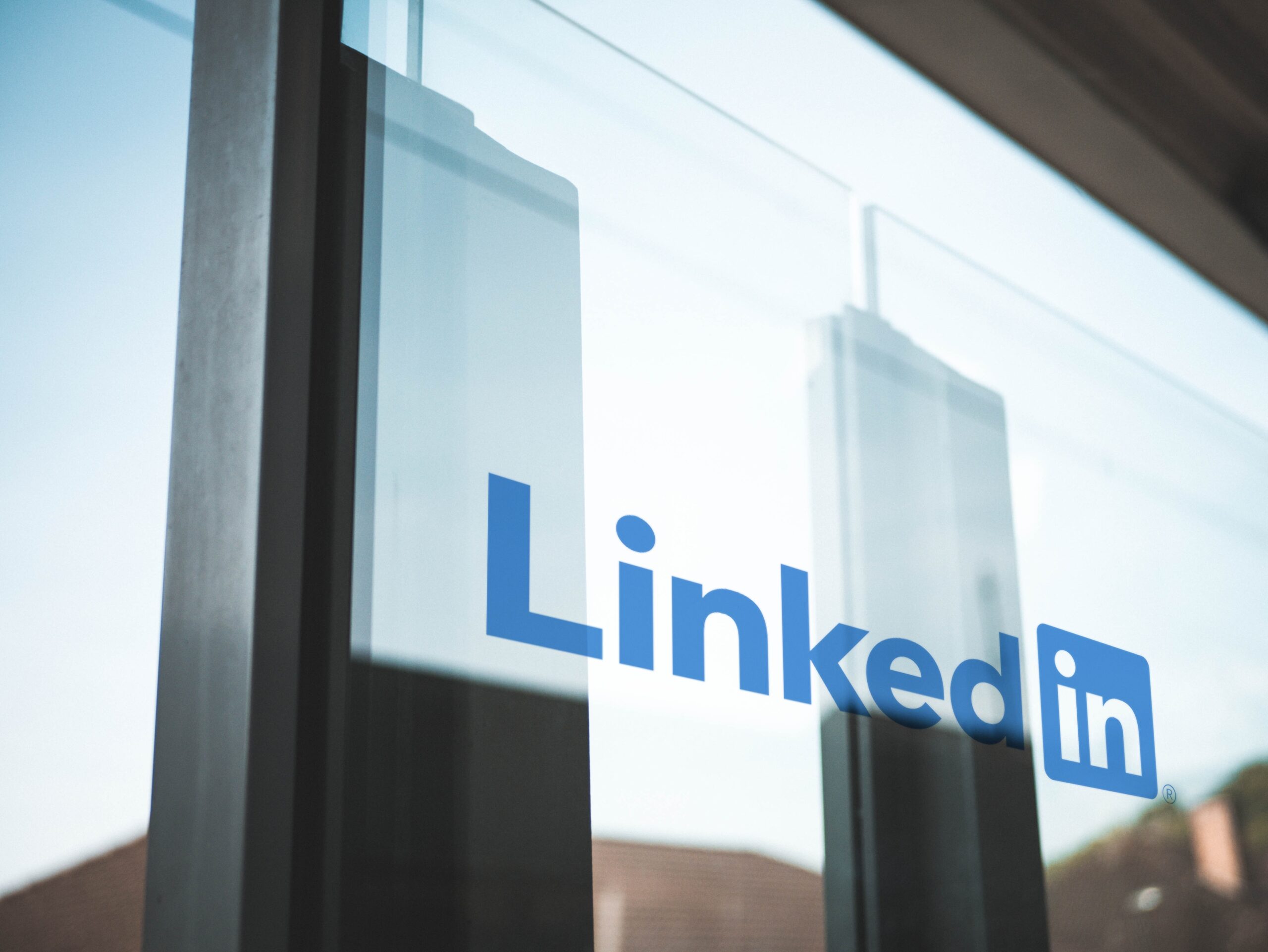 LinkedIn logo on a glass window