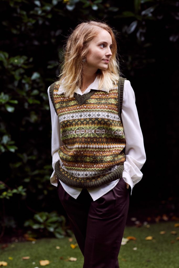 Woman with patterned jumper outside