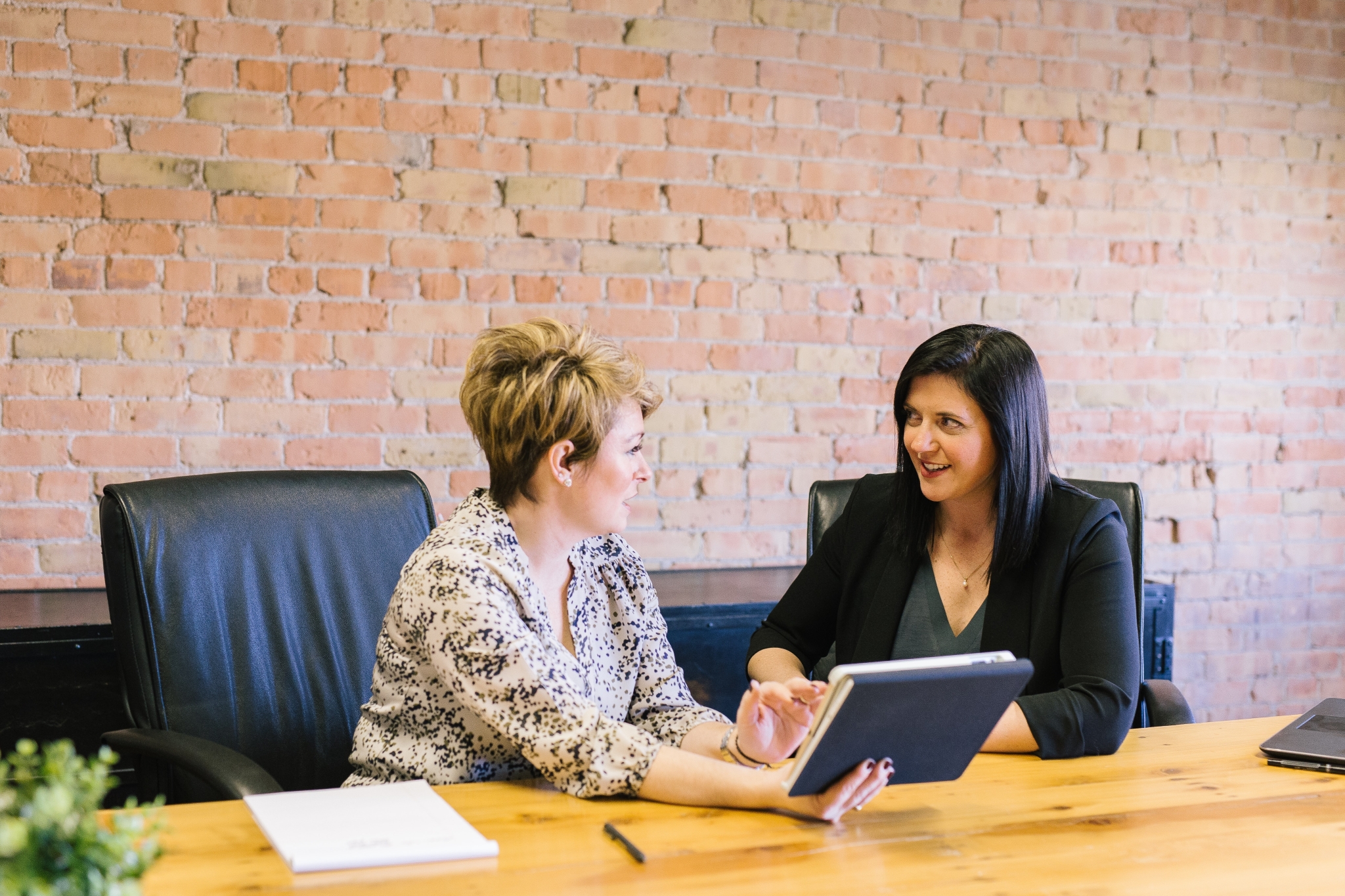 Two women discussing work