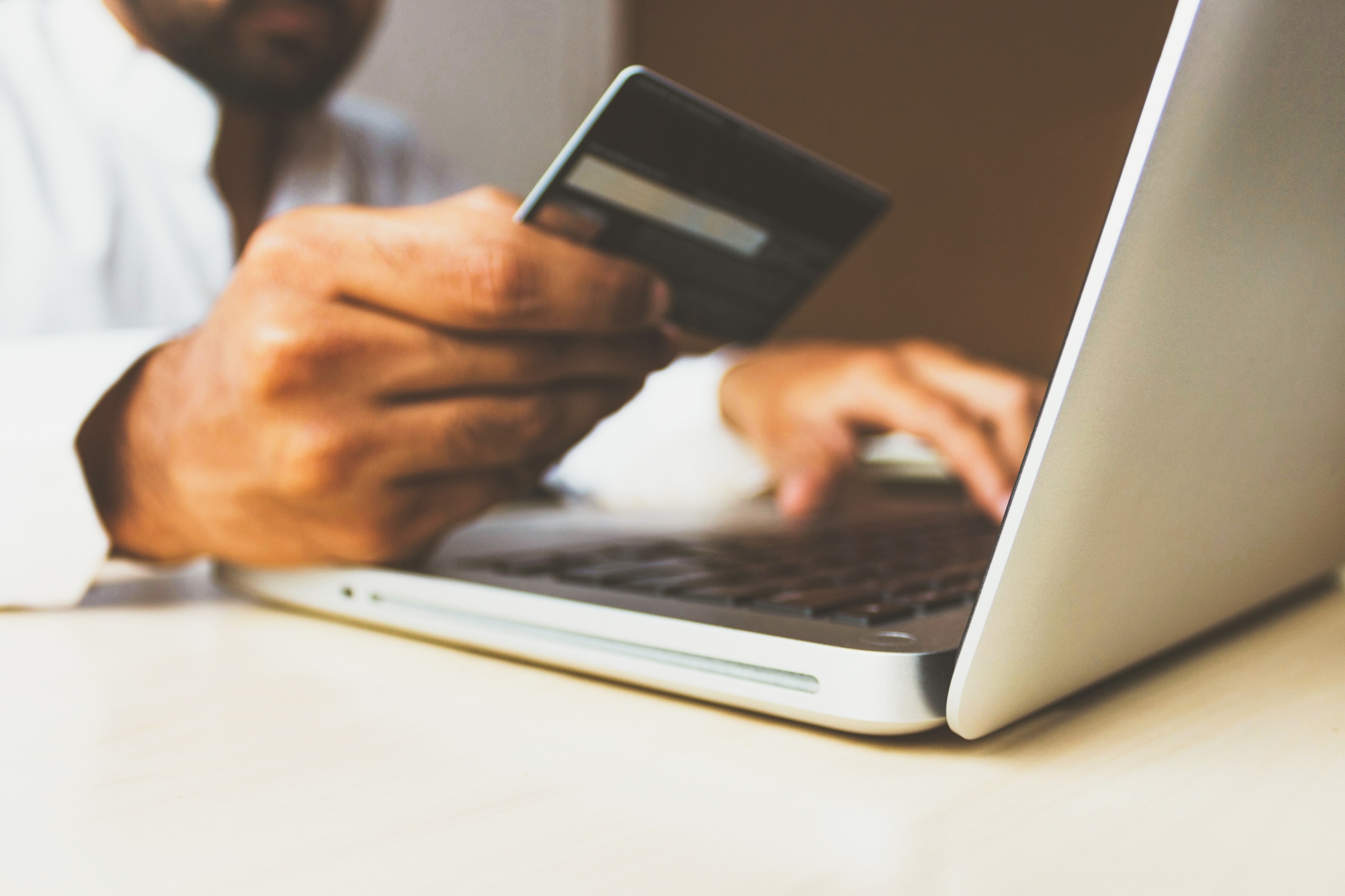 Credit card in front of laptop screen