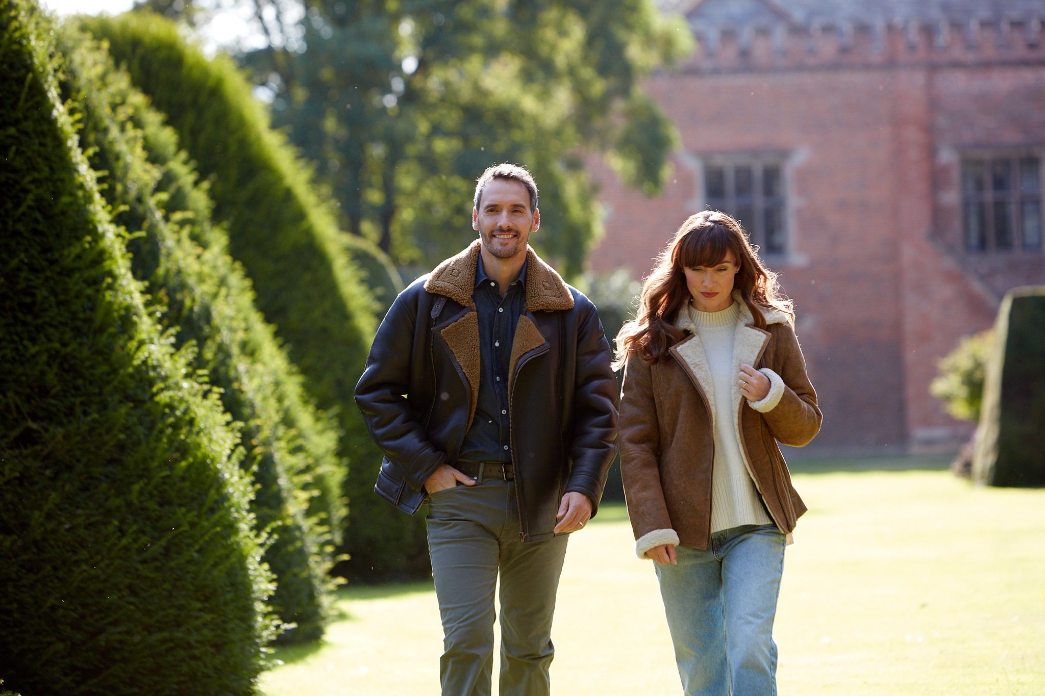 man and woman walking in leather jackets