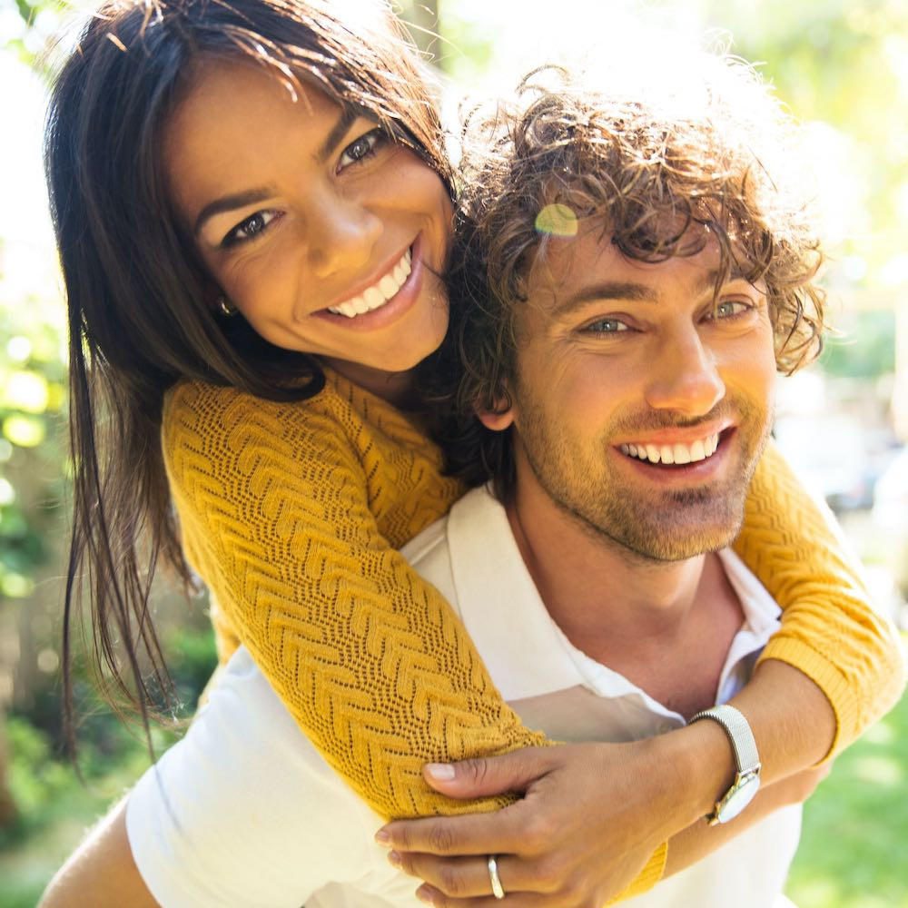 couple smiling and hugging