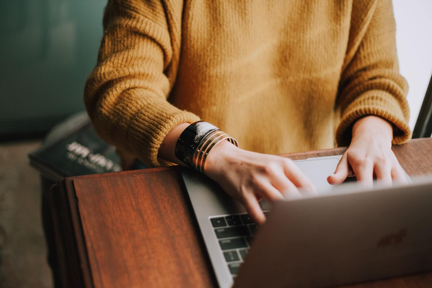 Person sat at desk using laptop